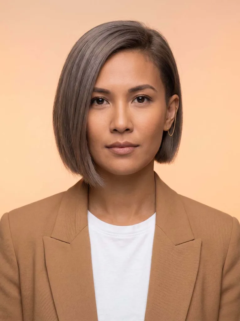 Woman with asymmetrical bixie haircut showing one side longer than the other — asymmetrical bixie hairstyle