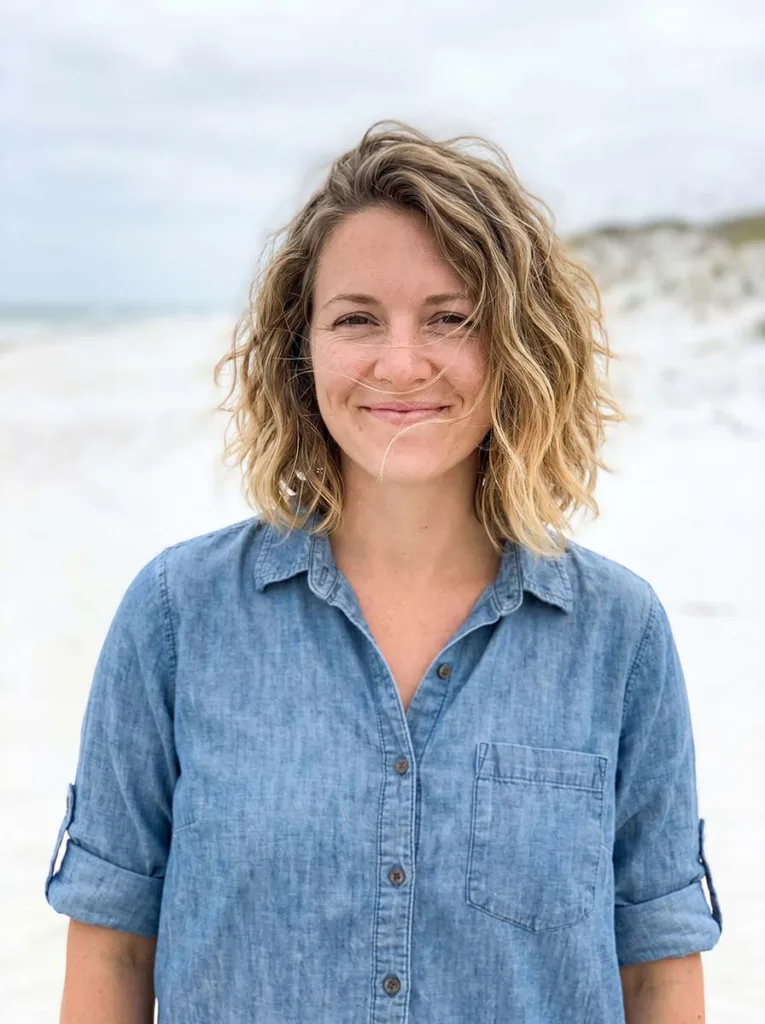 Woman with a beachy shoulder-length wavy bob, loose tousled waves and natural sandy texture