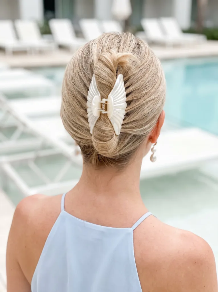 French twist shell clip bun with vertical clip placement on fine medium hair at a resort