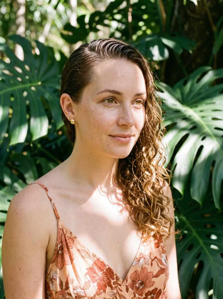 side-swept wet tuck with beach curls wet look hairstyle — one side slicked behind ear, glossy curls on opposite side