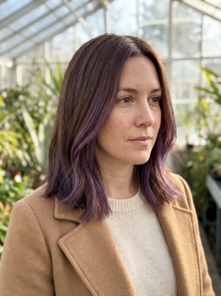 Woman with chocolate brown to violet balayage hair color technique